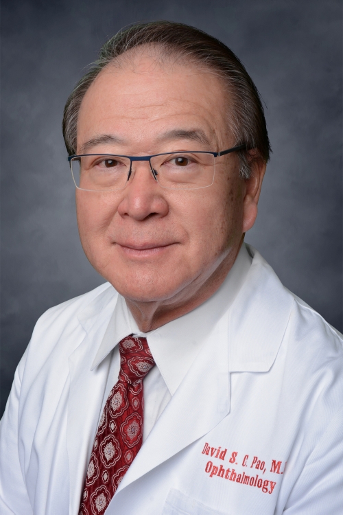 Photo of David Pao in a white lab jacket and red tie.